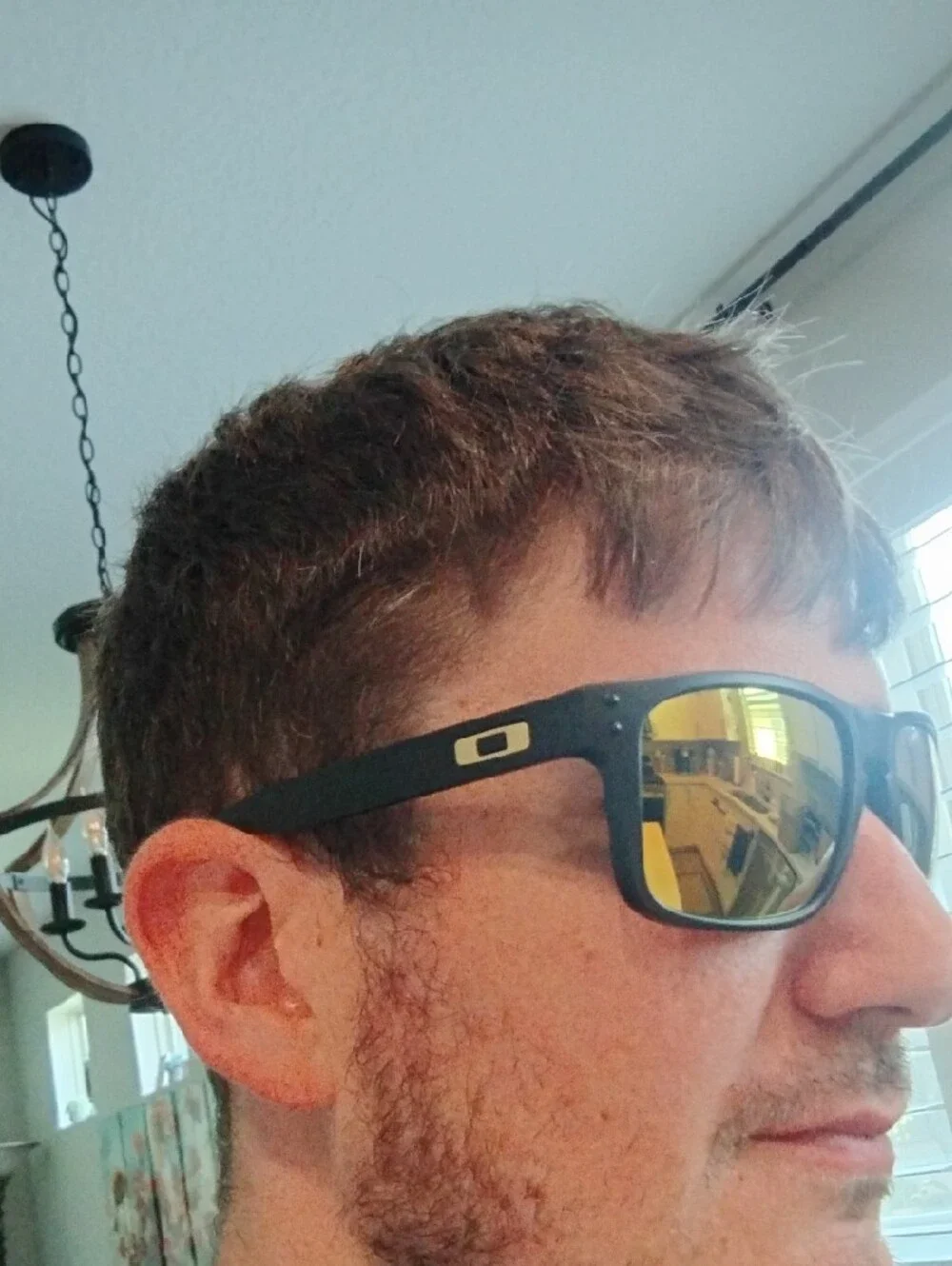 Oakley Matte Black Sunglasses with Yellow-Orange Mirror Lenses